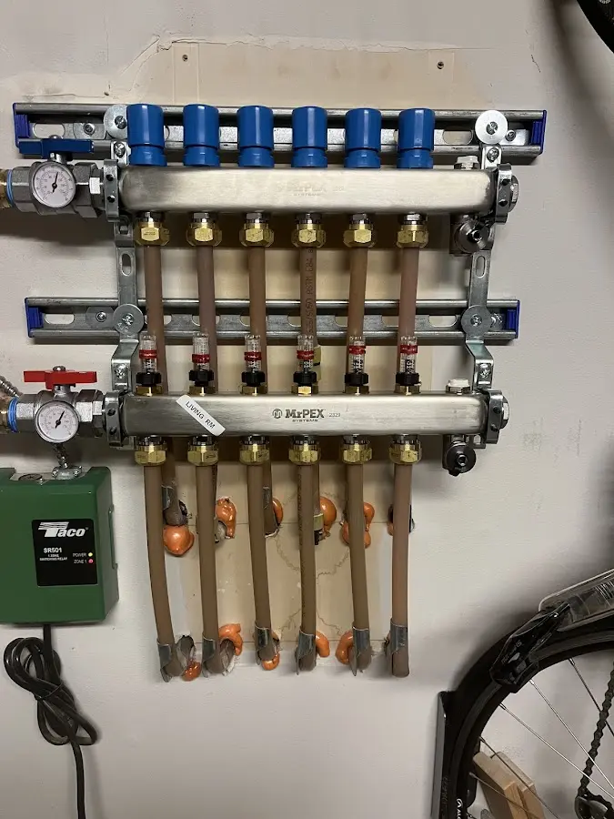 Plumber performing Water Heater Repair at a residential property in Foxborough